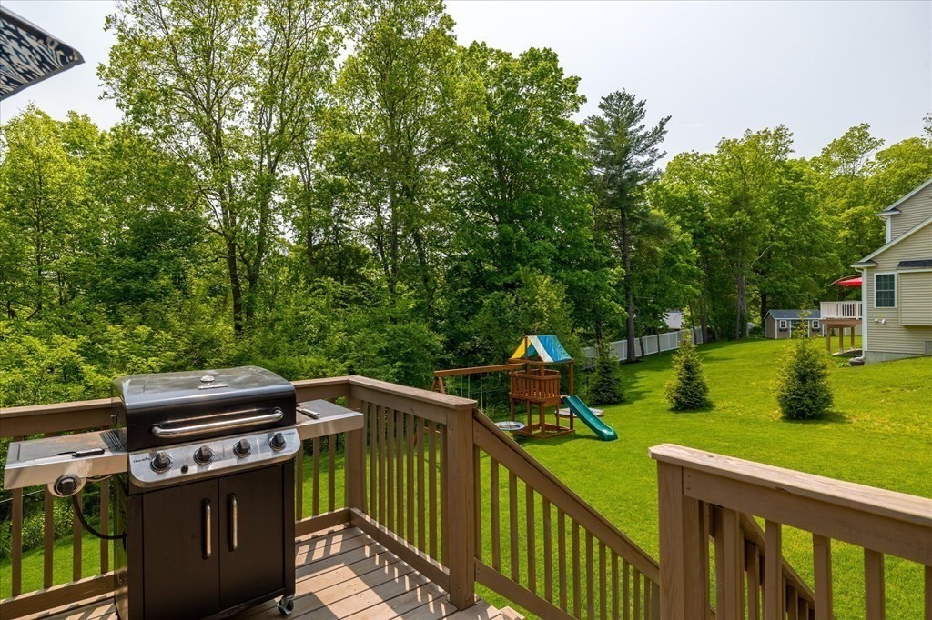 15 Tannery Road Sturbridge, MA 01518 - Photo 33 of 41 a view of a deck with chairs and a yard with plants