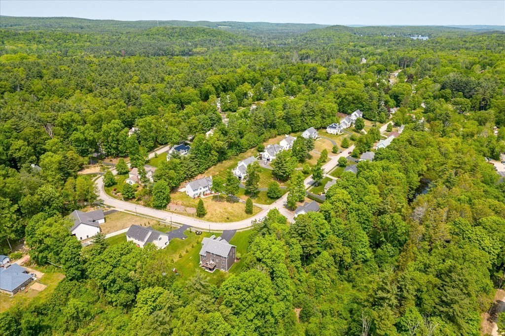 15 Tannery Road Sturbridge, MA 01518 - Photo 38 of 41 a view of a lush green field with lots of bushes