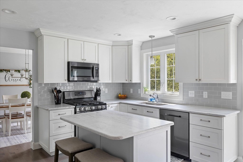 15 Tannery Road Sturbridge, MA 01518 - Photo 6 of 41 a kitchen with cabinets appliances a sink and a window