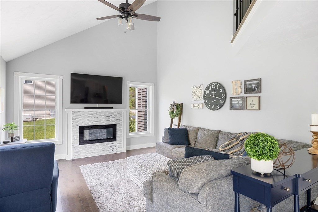 15 Tannery Road Sturbridge, MA 01518 - Photo 10 of 41 a living room with furniture a flat screen tv and a fireplace
