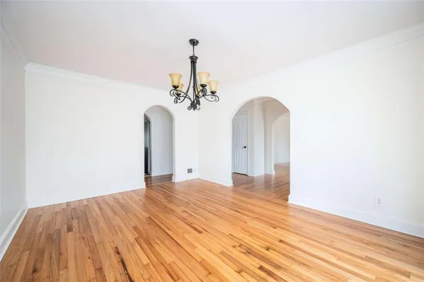 a kitchen with stainless steel appliances granite countertop a sink and dishwasher a stove top oven with white cabinets