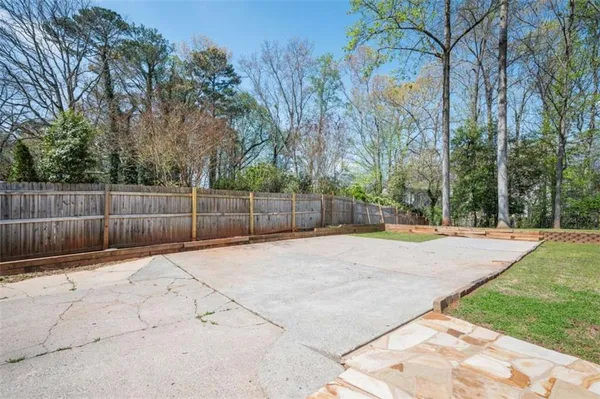 a view of a backyard of the house