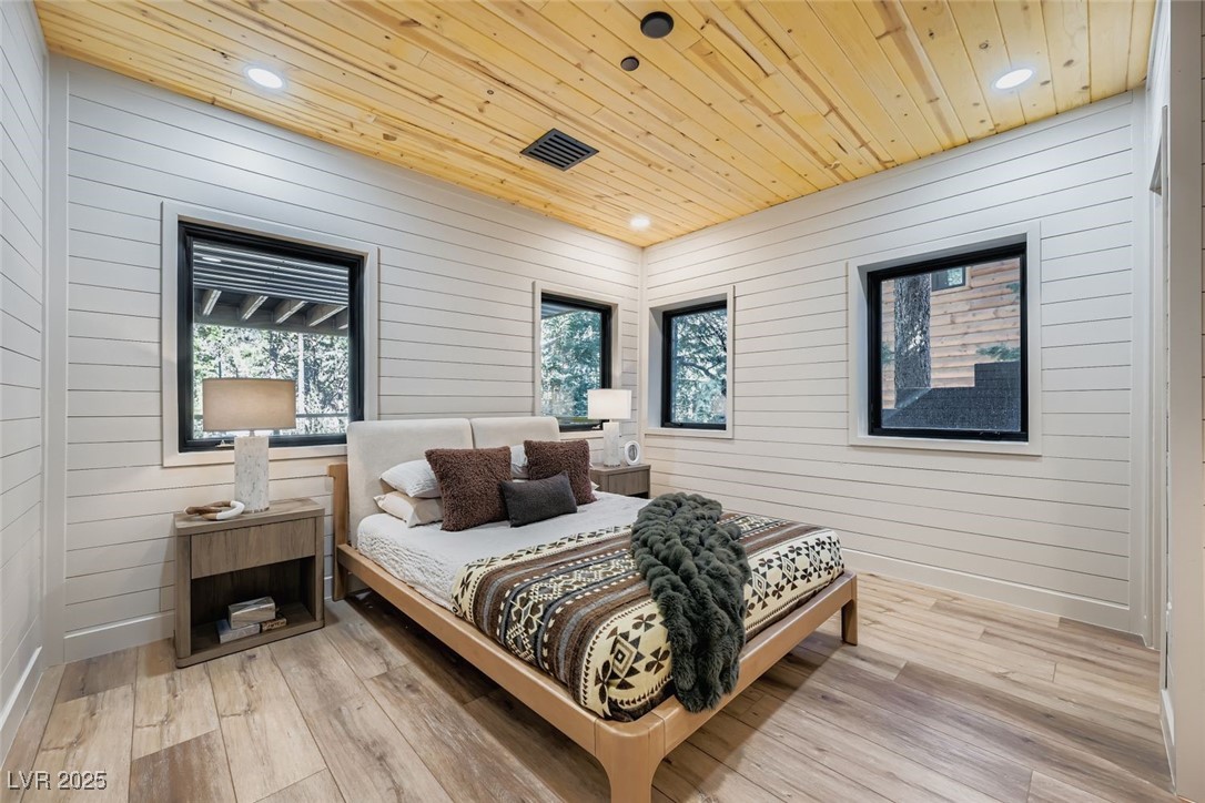 4096 Tyrol Way Mount Charleston, NV 89124 - Photo 15 of 50 The downstairs bedroom is perfect also for a bunk room (there is a space in the back that is not pictured) that could also be used as an office. It's a secluded part of the home that has a lot of quiet, as it's set off from a lot of the rest of the home. very good for guests having their own space, or extra family members, friends, or children's space that is complete and seperate from the rest of the house. There are a lot of spaces like this in the downstairs of the home.