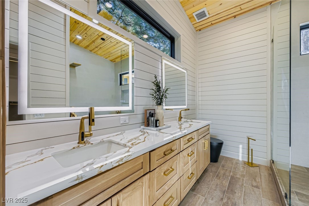 4096 Tyrol Way Mount Charleston, NV 89124 - Photo 9 of 50 Bathrooms were central to the design of the home. With all bath and shower hardware being imported from various places around the globe, finding the perfect blend of technology, design, and function, all 3 of the bathrooms feature European Luxury standards like multi-function selectable shower systems. Simple. Elegant. Beautiful. Sink faucets with swivel technology for stream or spray, with telescopic movement for easy wash and rinsing.