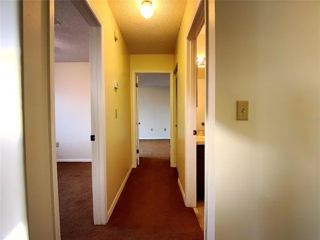 a view of a bathroom from a hallway