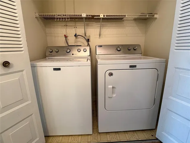 a utility room with dryer and washer