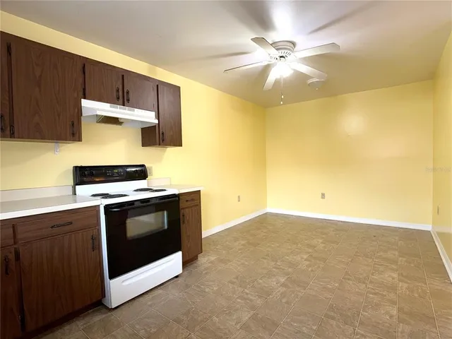 a kitchen with a stove and a microwave