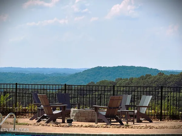 a view of a terrace with a table and chairs