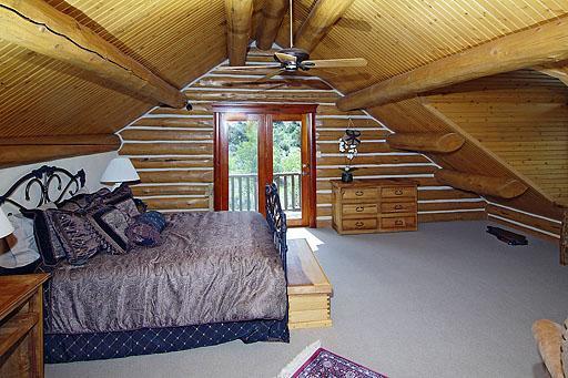 300 Horse Mountain Ranch Road Wolcott, CO 81655 - Photo 11 of 19 a bedroom with bed and wooden floor