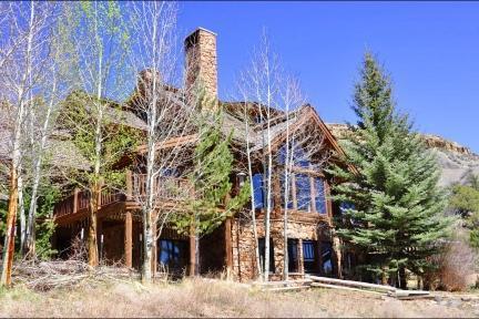 300 Horse Mountain Ranch Road Wolcott, CO 81655 - Photo 17 of 19 a front view of a building with a garden
