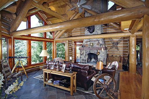 300 Horse Mountain Ranch Road Wolcott, CO 81655 - Photo 5 of 19 a living room with furniture a fireplace and floor to ceiling windows