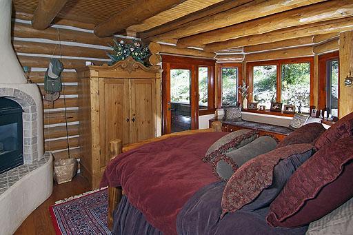 300 Horse Mountain Ranch Road Wolcott, CO 81655 - Photo 9 of 19 a spacious bedroom with a bed couch and a large window
