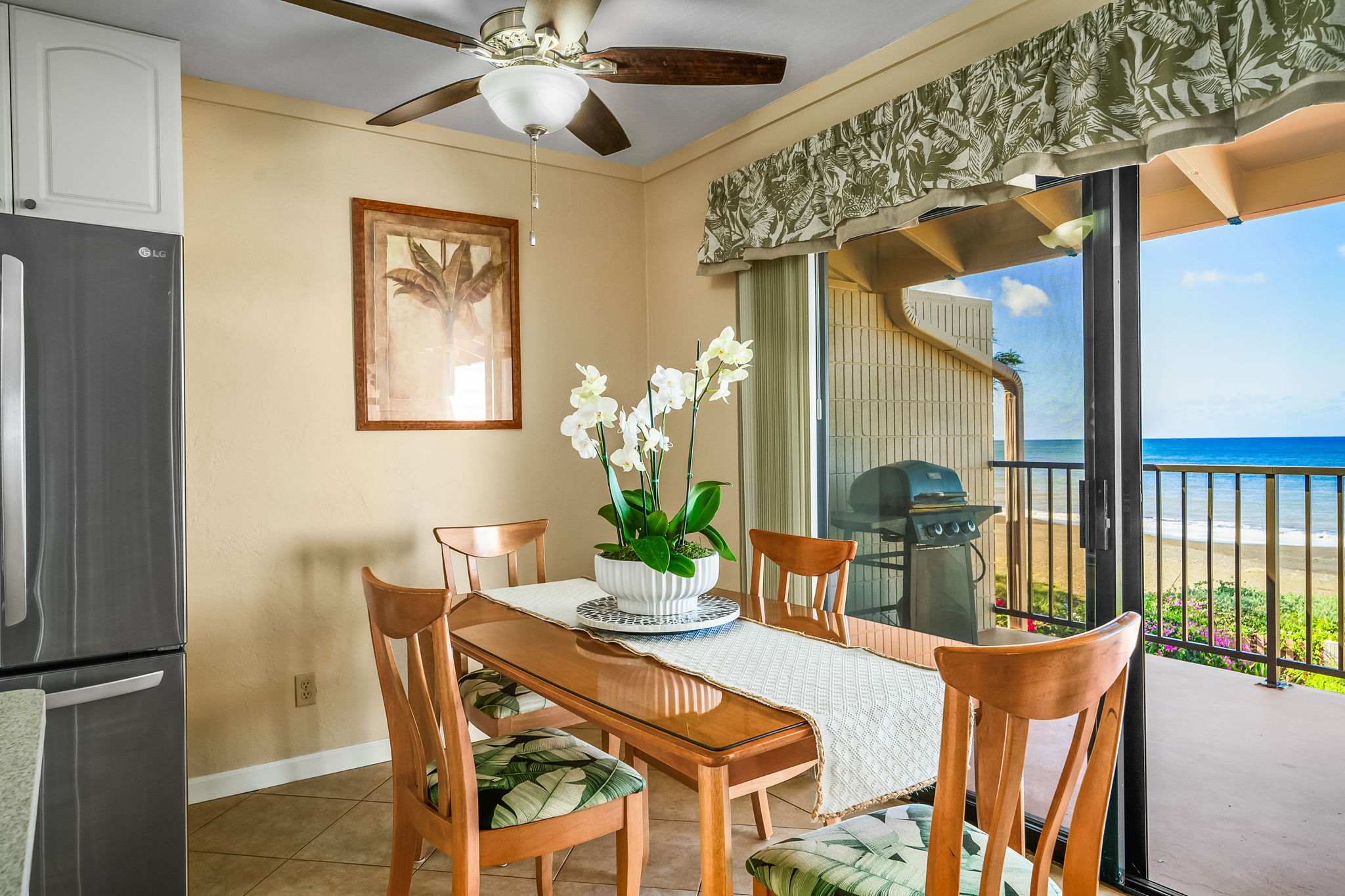 4451 Moana Road, Unit 309 Waimea, HI 96796 - Photo 6 of 21 a dining room with furniture potted plants and wooden floor