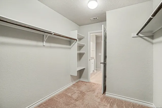 a view of an empty walk in closet