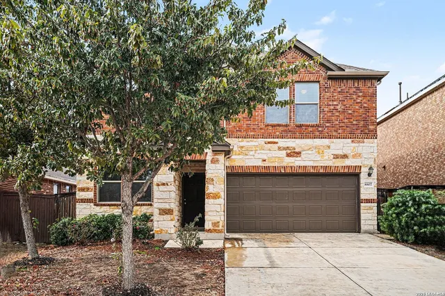 front view of a house with a garage
