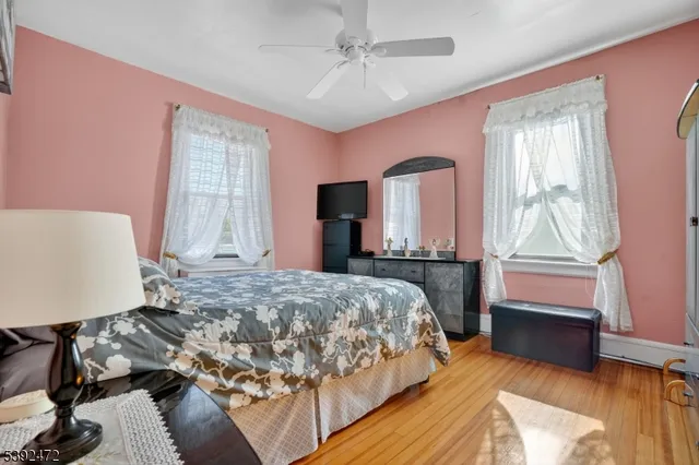 a bedroom with a large bed and a window