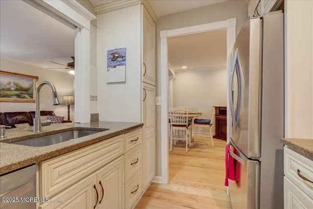 a hallway with sink and mirror
