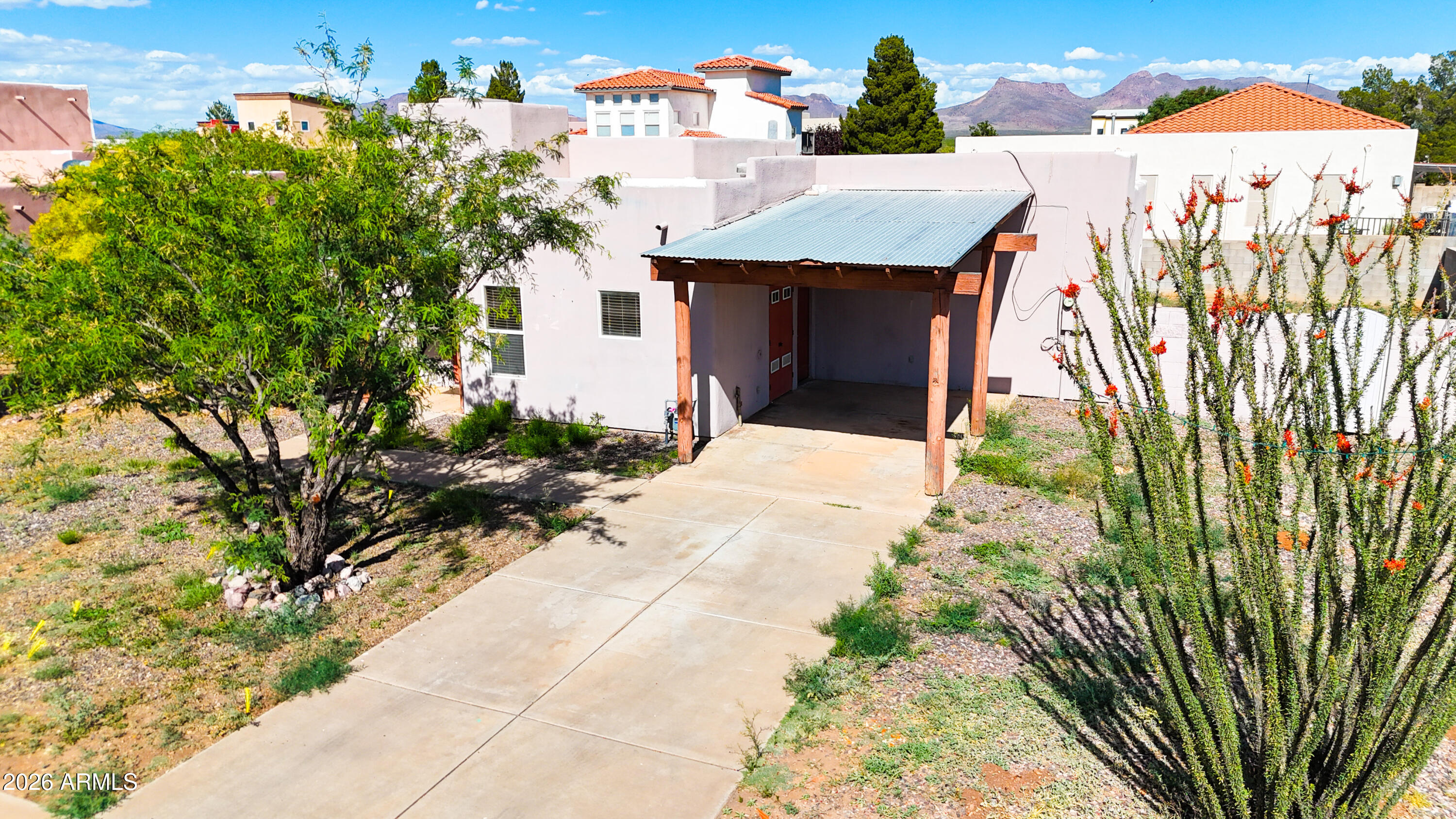 4105 North Washington Avenue Douglas, AZ 85607 - Photo 31 of 61 a view of a house with a yard and potted plants