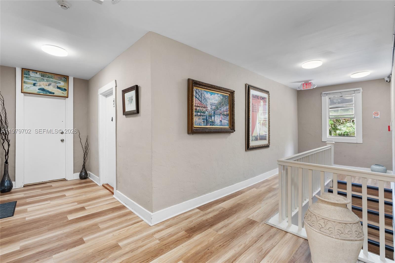 3409 South Le Jeune Road Coral Gables, FL 33134 - Photo 45 of 53 a view of a hallway with wooden floor and windows