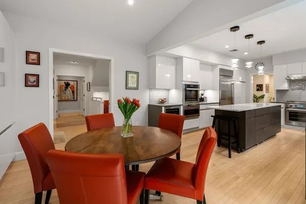a dining room with furniture and window
