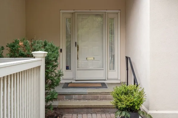 a view of front door with a potted plant