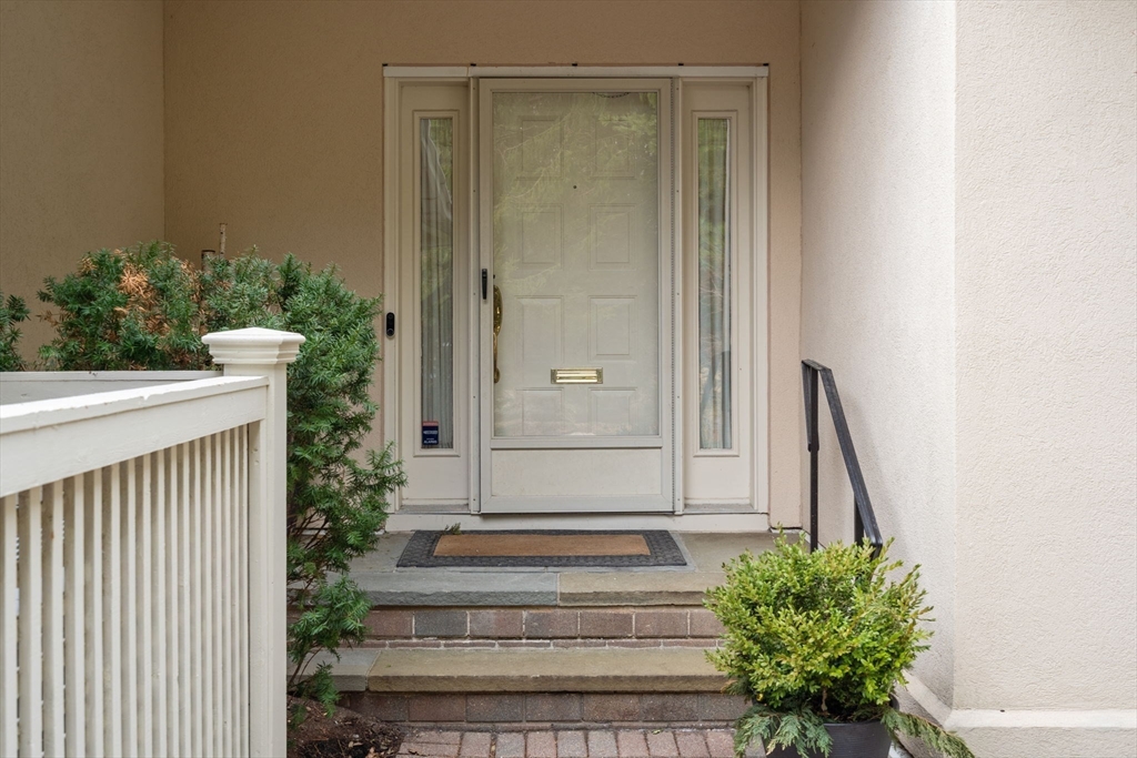 202 Allandale Road, Unit B Boston, MA 02467 - Photo 2 of 39 a view of front door with a potted plant