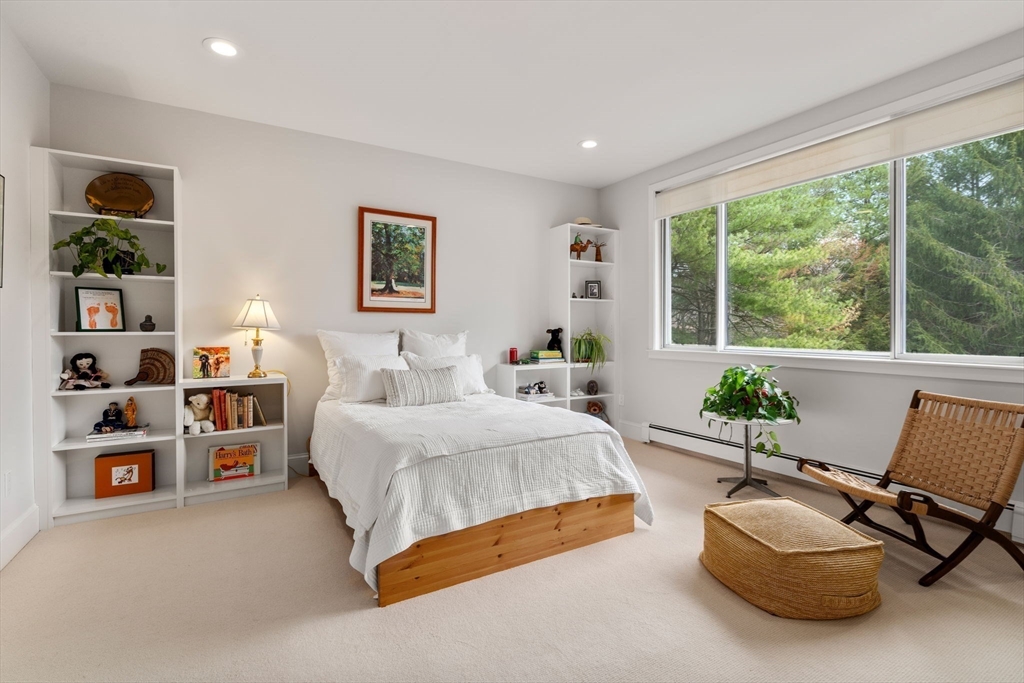 202 Allandale Road, Unit B Boston, MA 02467 - Photo 21 of 39 a spacious bedroom with a bed and a couch