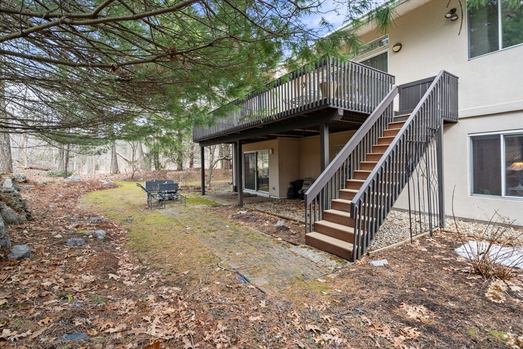 202 Allandale Road, Unit B Boston, MA 02467 - Photo 31 of 39 a view of backyard with deck and outdoor seating