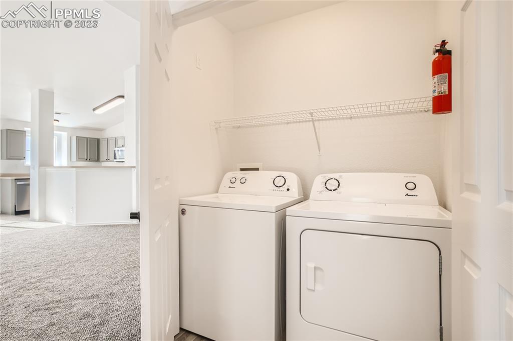 3764 Riviera Grove, Unit 203 Colorado Springs, CO 80922 - Photo 14 of 31 a utility room with dryer and washer