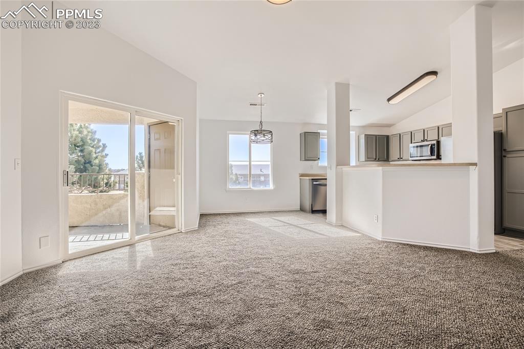 3764 Riviera Grove, Unit 203 Colorado Springs, CO 80922 - Photo 16 of 31 a view of a big room with windows and entryway