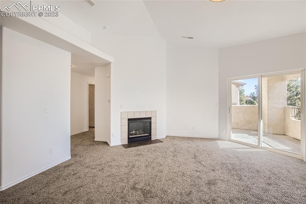 3764 Riviera Grove, Unit 203 Colorado Springs, CO 80922 - Photo 18 of 31 a view of an empty room with a fireplace
