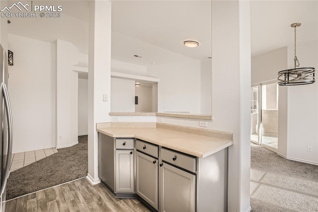 3764 Riviera Grove, Unit 203 Colorado Springs, CO 80922 - Photo 20 of 31 a kitchen with a sink cabinets and appliances