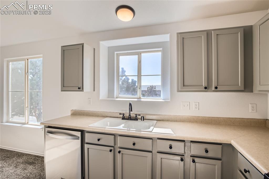 3764 Riviera Grove, Unit 203 Colorado Springs, CO 80922 - Photo 22 of 31 a bathroom with a sink and a mirror