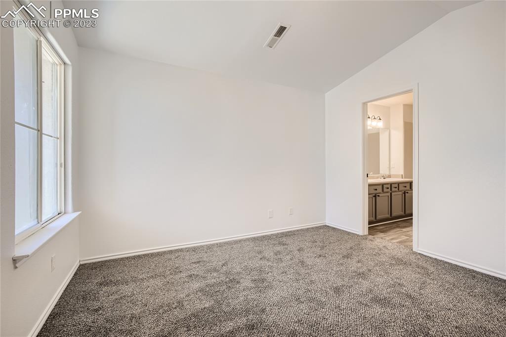 3764 Riviera Grove, Unit 203 Colorado Springs, CO 80922 - Photo 5 of 31 an empty room with windows