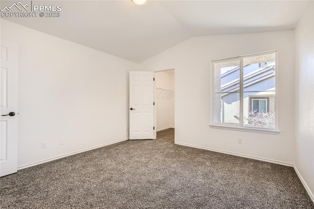 3764 Riviera Grove, Unit 203 Colorado Springs, CO 80922 - Photo 6 of 31 an empty room with windows