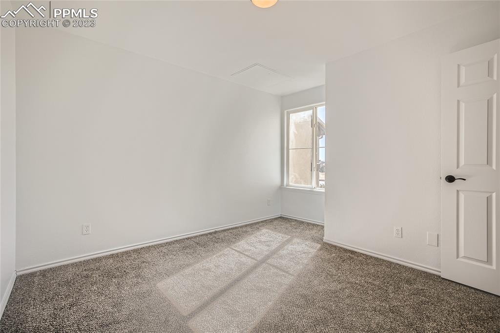 3764 Riviera Grove, Unit 203 Colorado Springs, CO 80922 - Photo 9 of 31 an empty room with windows