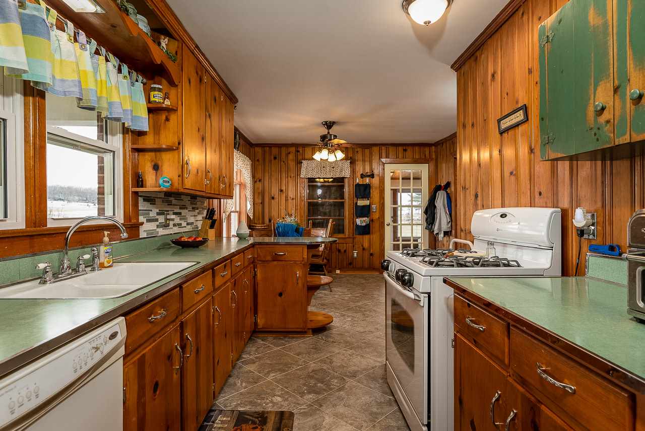 4273 Rockfish Road Grottoes, VA 24441 - Photo 19 of 48 a kitchen with stainless steel appliances granite countertop sink stove and cabinets
