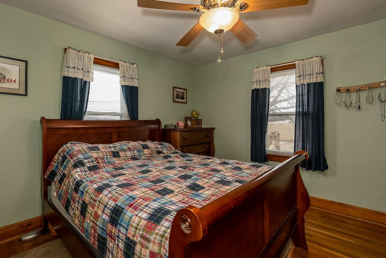 4273 Rockfish Road Grottoes, VA 24441 - Photo 23 of 48 a bedroom with a bed and wooden floor