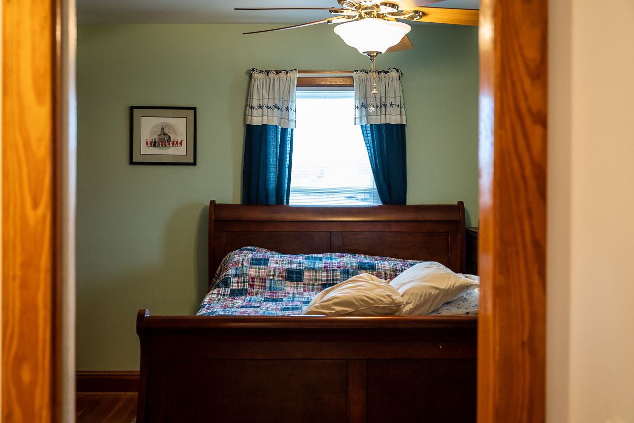 4273 Rockfish Road Grottoes, VA 24441 - Photo 27 of 48 a bed room with furniture and a mirror
