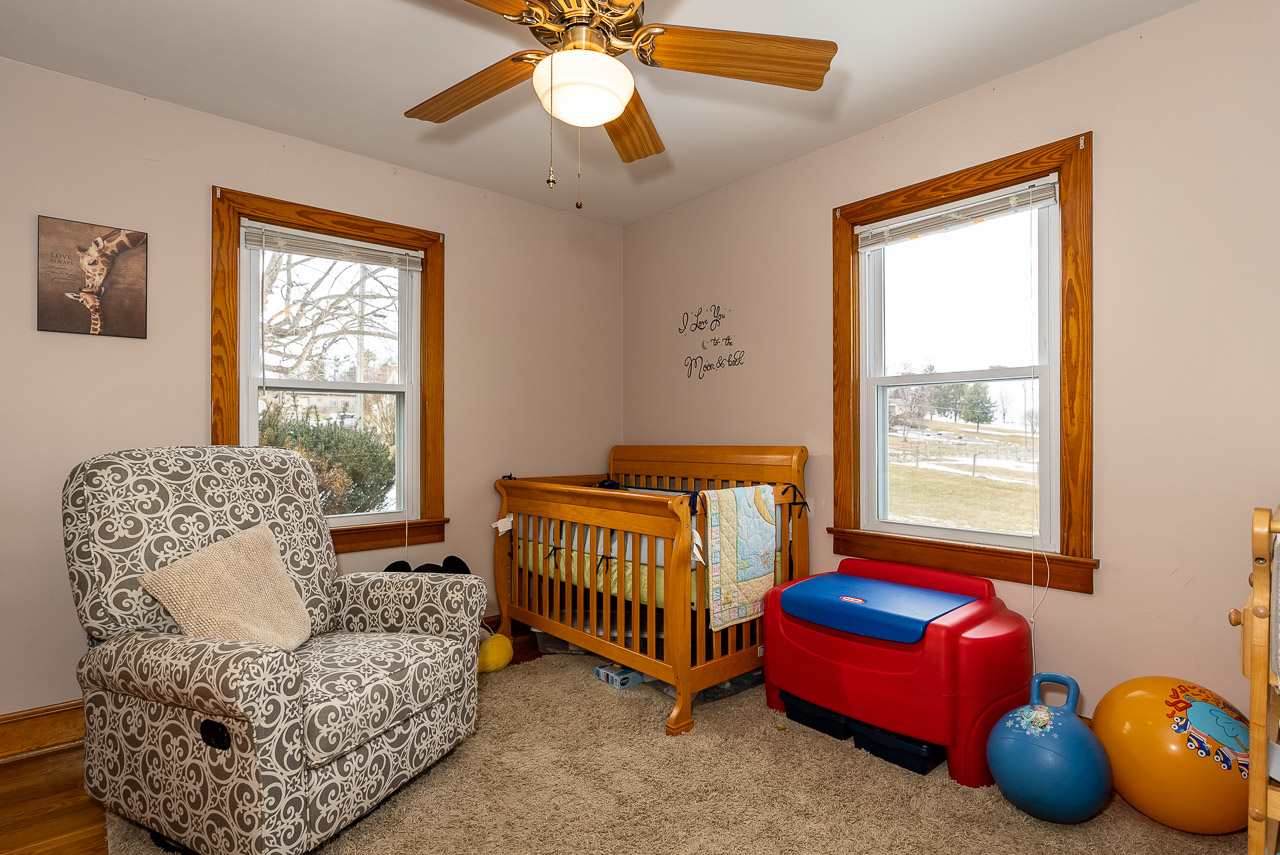 4273 Rockfish Road Grottoes, VA 24441 - Photo 32 of 48 a bedroom with a bed and a chandelier