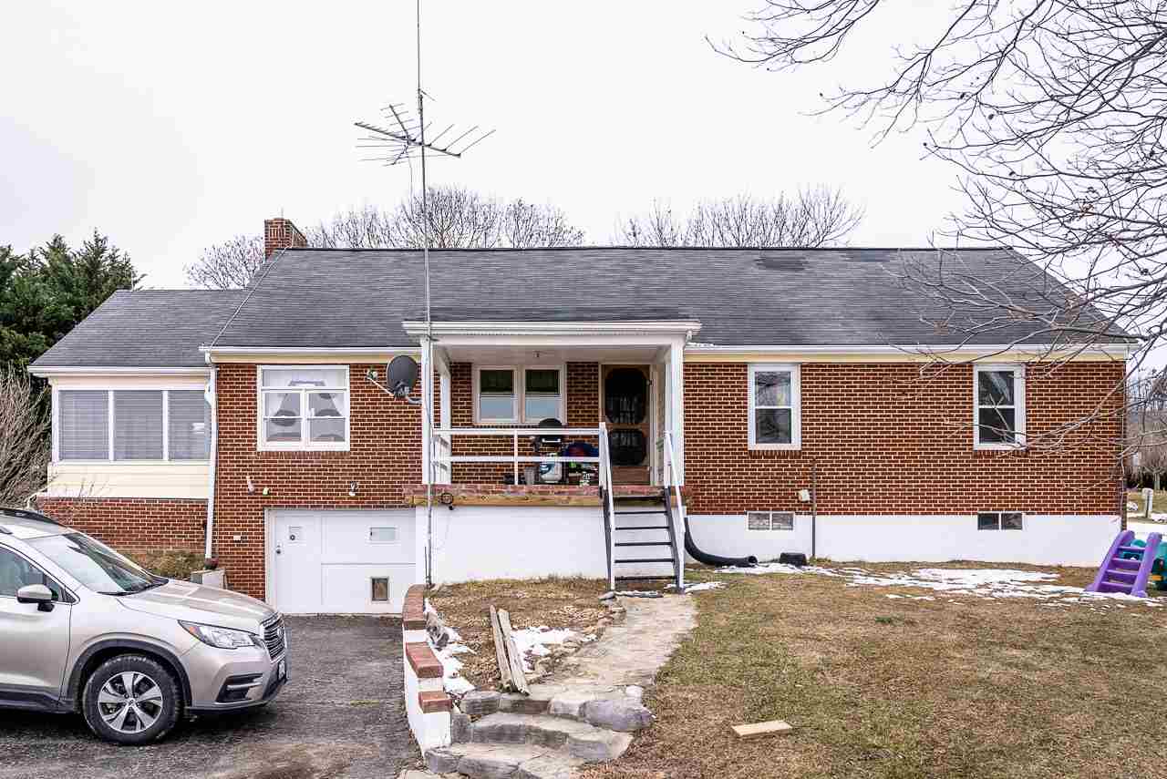 4273 Rockfish Road Grottoes, VA 24441 - Photo 47 of 48 a front view of a house with a yard and parking space