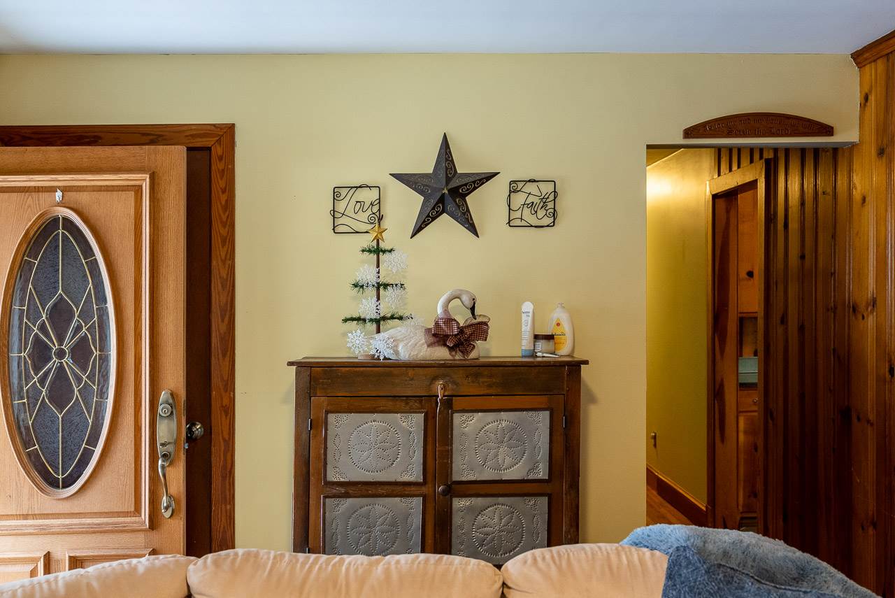 4273 Rockfish Road Grottoes, VA 24441 - Photo 7 of 48 a bedroom with a bed and a chandelier