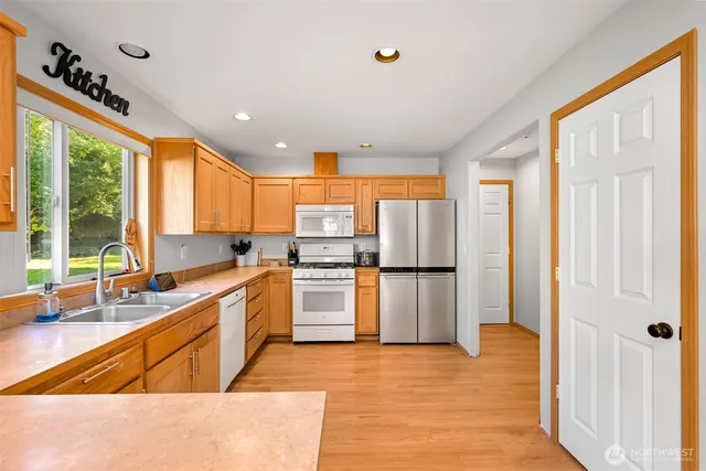 a kitchen with lots of counter top space and dining table
