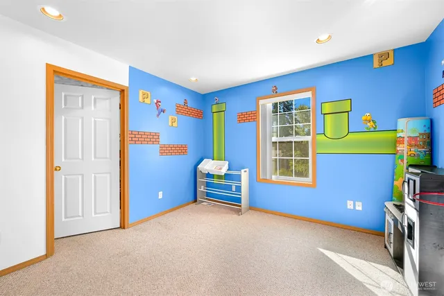 a bedroom with a bed and a dresser