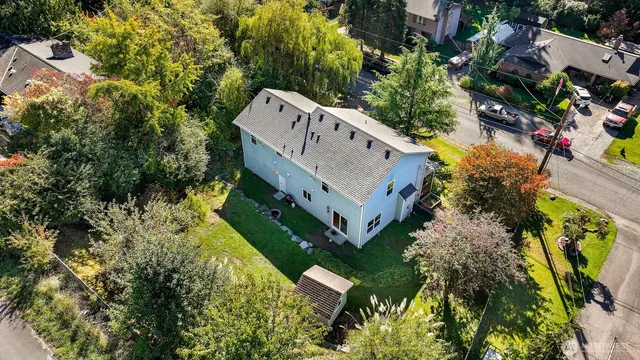 an aerial view of a house with a yard and garden
