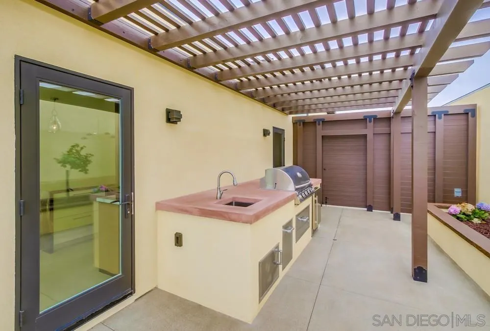 14066 Crest Way Del Mar, CA 92014 - Photo 30 of 32 a bathroom with a sink a mirror and shower