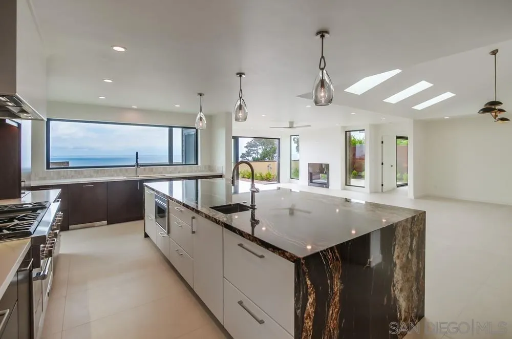 14066 Crest Way Del Mar, CA 92014 - Photo 5 of 32 a kitchen with a sink a counter space appliances and cabinets