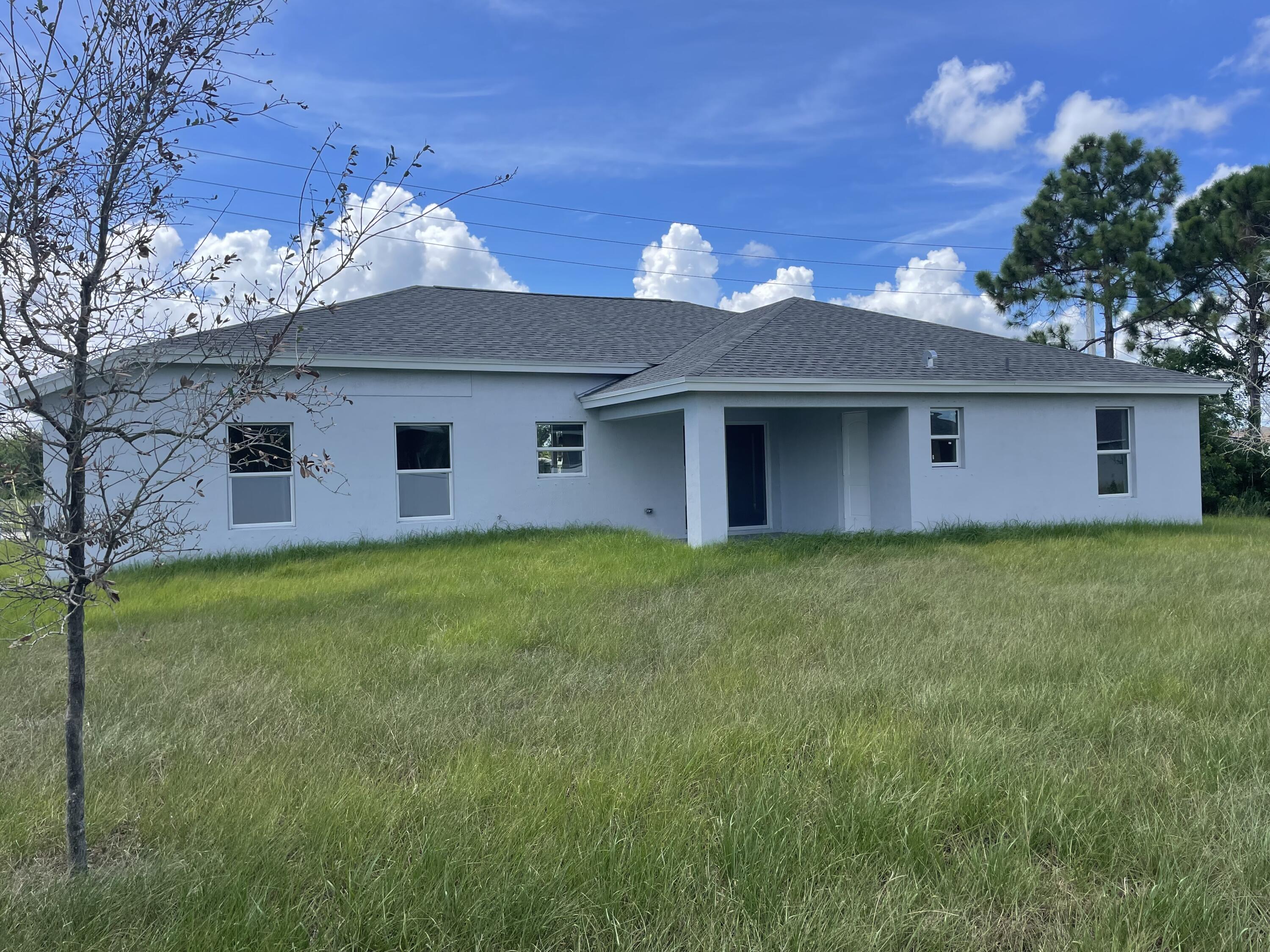 310 Southwest Becker Road Port St. Lucie, FL 34953 - Photo 14 of 15 310 Becker Rd Rear