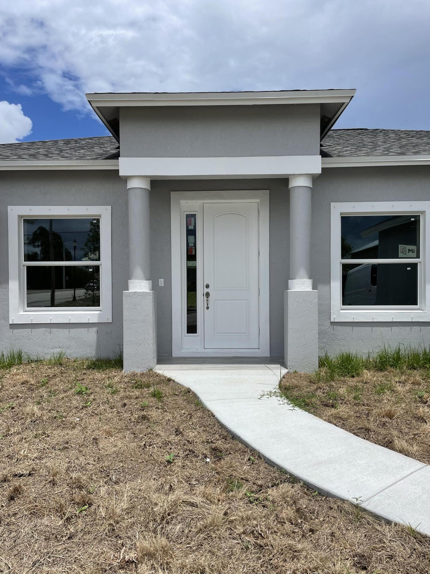 310 Southwest Becker Road Port St. Lucie, FL 34953 - Photo 2 of 15 Sunrise Model Main Entrance