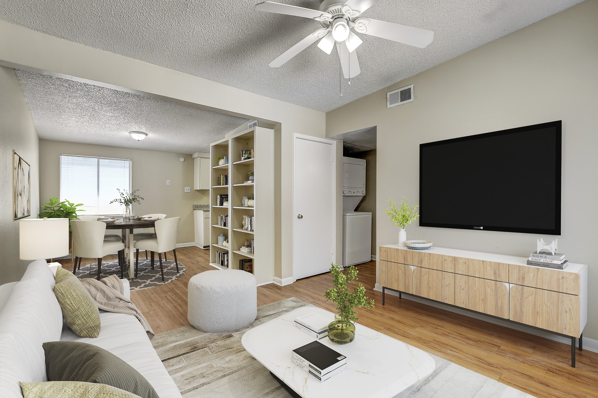 2408 Longview Street, Unit 211 Austin, TX 78705 - Photo 6 of 23 Living area featuring stacked washer and dryer, a textured ceiling, light wood-style floors, and ceiling fan